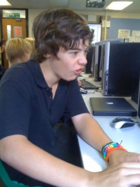 Harry Styles on a computer at school