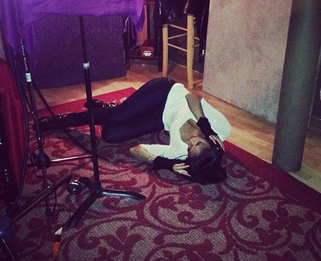 Nicole Scherzinger lying on the floor