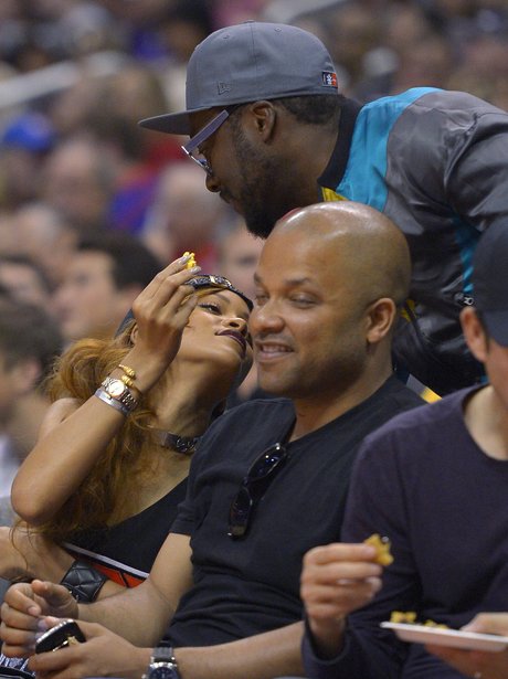 Rihanna and Will.i.am at the basketball match