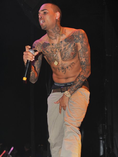 Chris Brown performing topless with tattoos