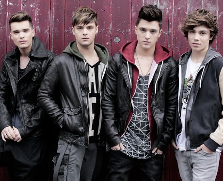 Union J standing in front of a red wall