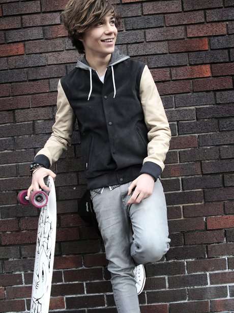 Union J's George holding a skateboard