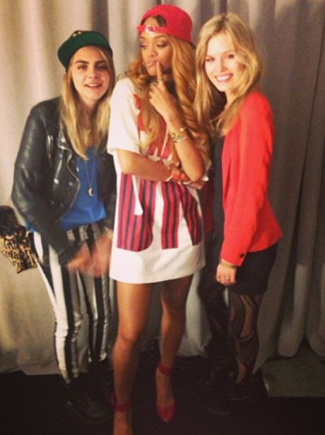 Rihanna poses with Cara Delevingne backstage at a concert