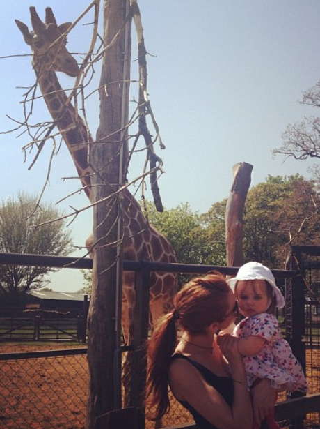 Una Healy is photobombed by a giraffe