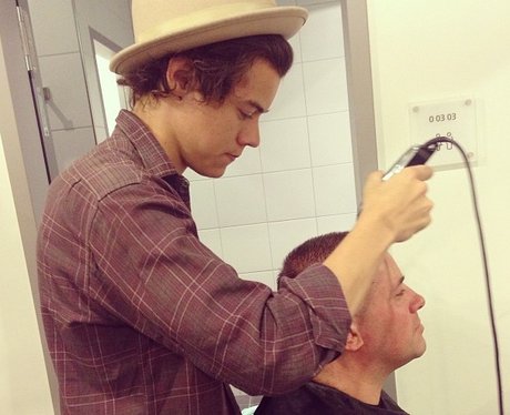 Harry Styles shaving someone's head