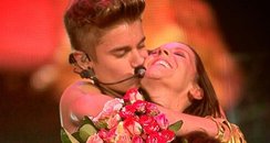 Justin Bieber and his mum on stage