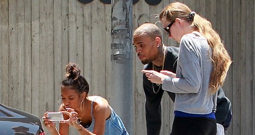 Chris Brown and Karrueche by his car