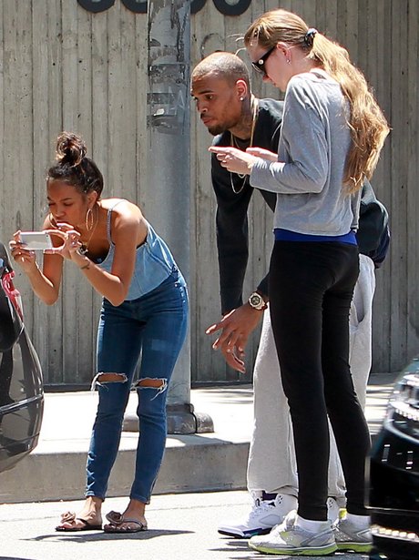 Chris Brown and Karrueche by his car