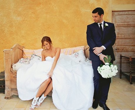 Example and wife Erin McNaught in their wedding outfits