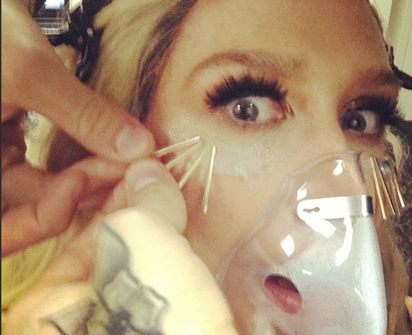 Ke$ha with mask over her mouth