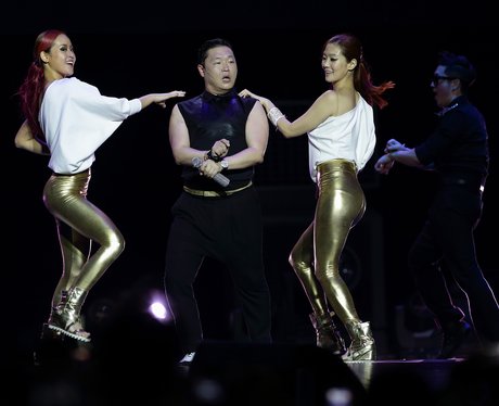 PSY performing with two female dancers in Singapore