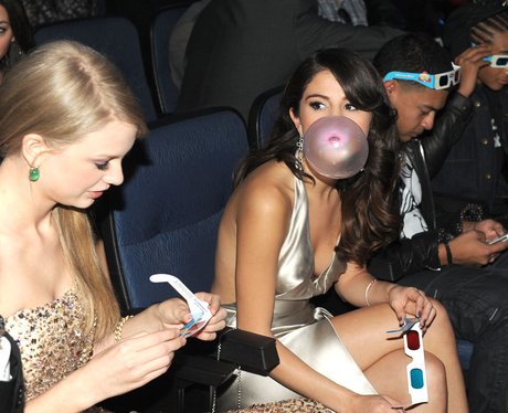 Selena Gomez blowing bubble gum