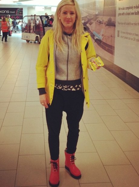 Ellie Goulding wearing a casual yellow jacket