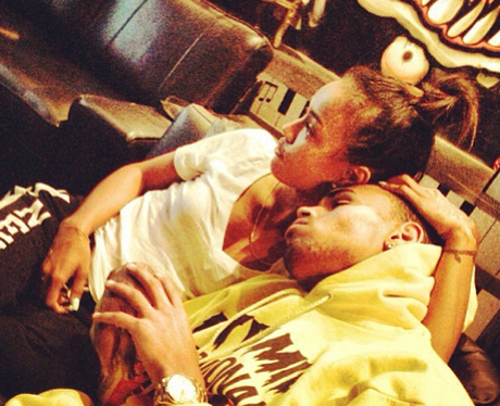 Chris Brown and Karrueche cuddling on sofa