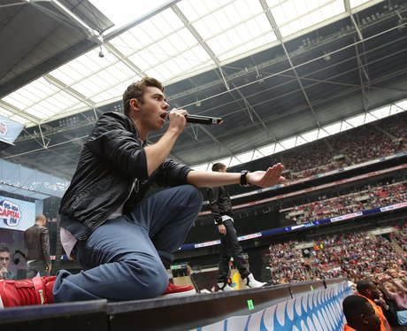 Nathan Sykes gets down at the front of Wembley Stadium