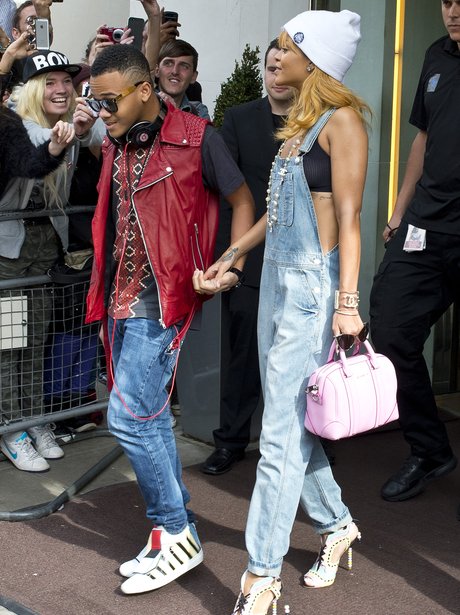 Rihanna holding hands with her brother