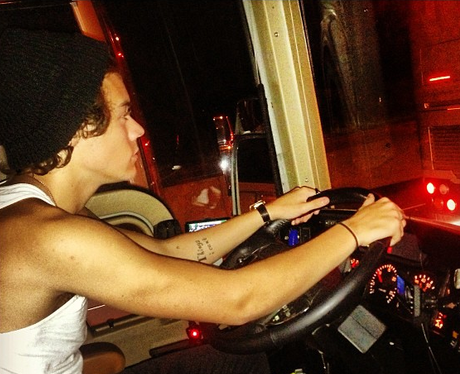 Harry Styles driving on tour