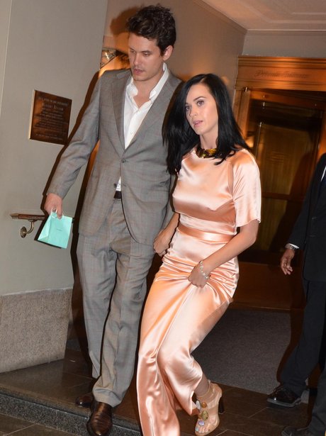 John Mayer and Katy Perry holding hands in satin pink dress