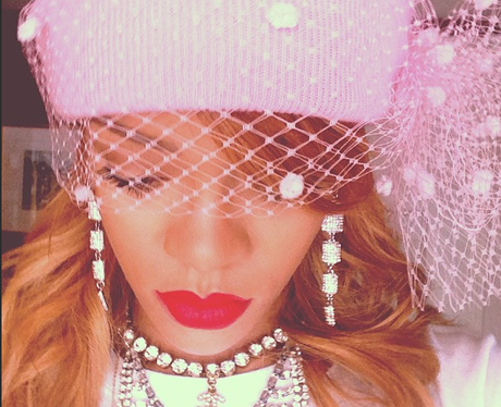 Rihanna wearing a headdress on the 'Diamonds' tour