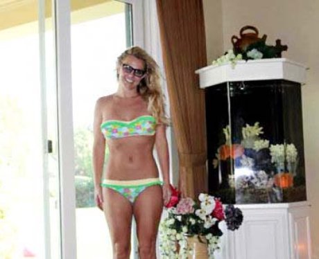 Britney Spears wearing a floral green bikini