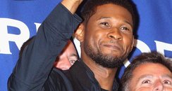 Usher rings the closing bell at the New York Stock