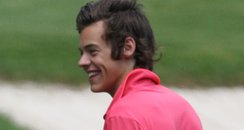 Harry Styles playing golf