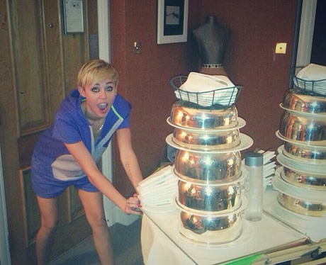 Miley Cyrus orders up some room service