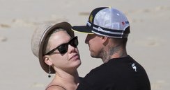 Pink and Carey Hart on the beach