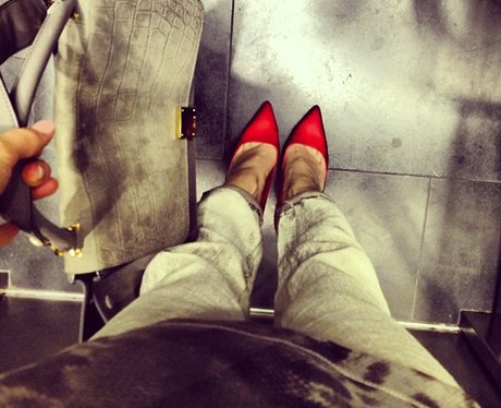 Jessie J in an elevator with red shoes