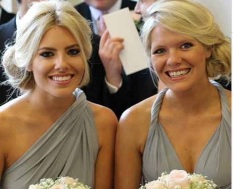 Mollie King and her sister wearing bridesmaid dress