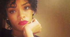 Rihanna with new hair and red lipstick