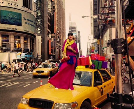 Rita Ora standing on the bonnet of a New York taxi