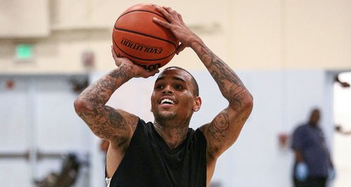 Chris Brown playing a charity basketball match