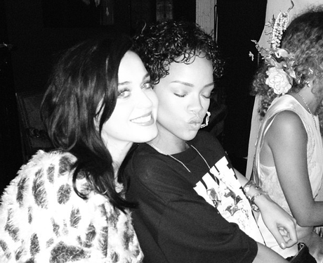 Katy Perry and Rihanna smiling at album launch party.