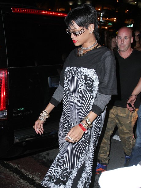 Rihanna wearing black and white dress on miami beach