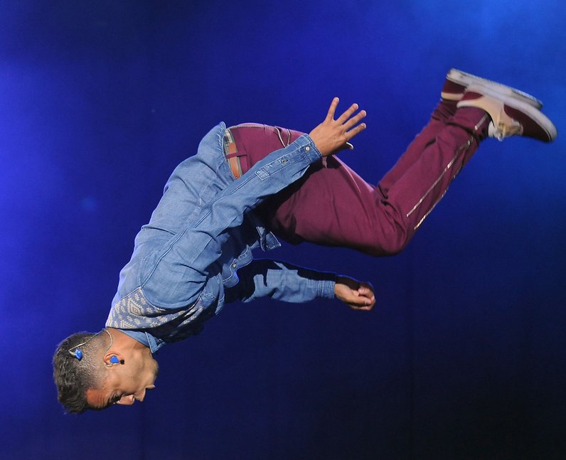 JLS star Aston Merrygold pulls out his trademark backflip at Fusion Festival 2013