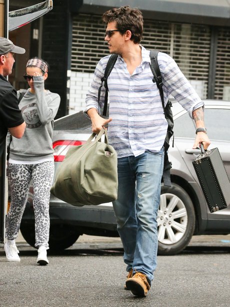 Katy Perry and John Mayer wearing a 'Roar' sweatshirt jumper