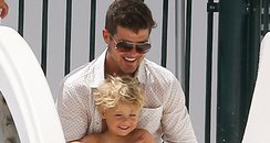 Robin Thicke on a water slide with his son