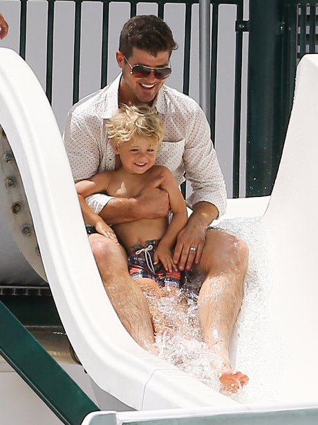 Robin Thicke on a water slide with his son