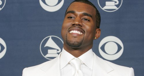 Kanye West holding Grammy Awards