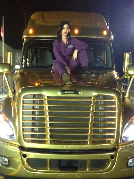 Katy Perry poses on top of her 'Prism' truck