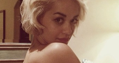 Rita Ora shows off her new tattoo