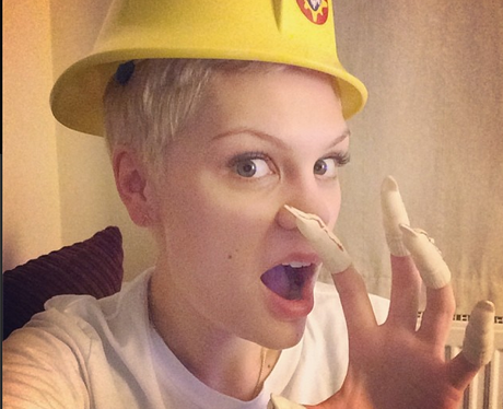 Jessie J wearing a hard hat