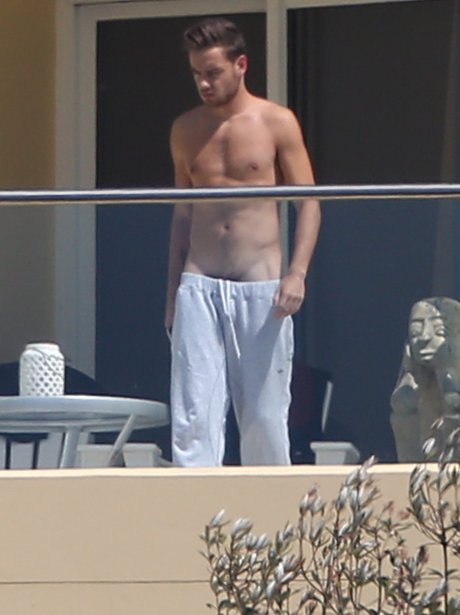 Liam Payne topless on balcony