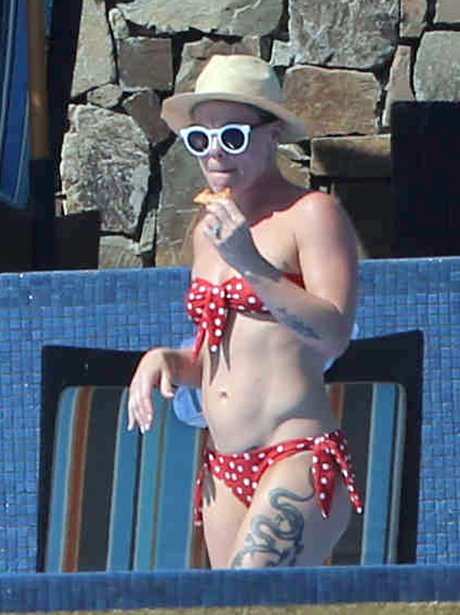 Pink wearing a bikini