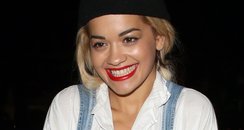 Rita Ora wearing dungareese