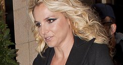 Britney Spears wearing a low cut dress in London