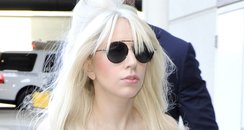 Lady Gaga at Lax Airport with a Claw Halloween bag