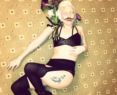 Lady Gaga wearing a moustache