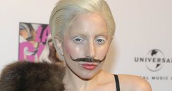 Lady Gaga wearing a moustache